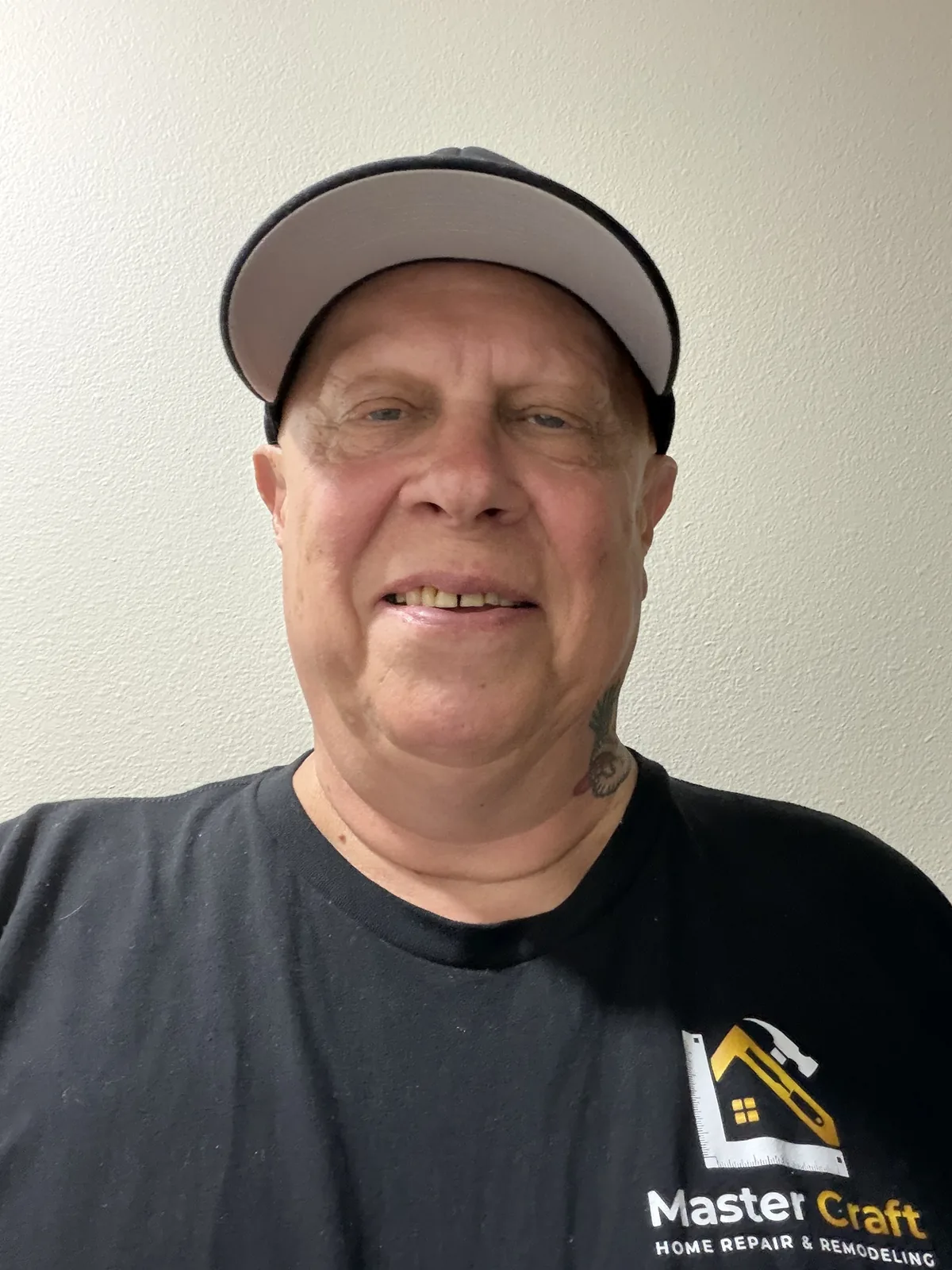 Greg, owner of Greg The Contractor, wearing a Master Craft Home Repair and Remodeling shirt